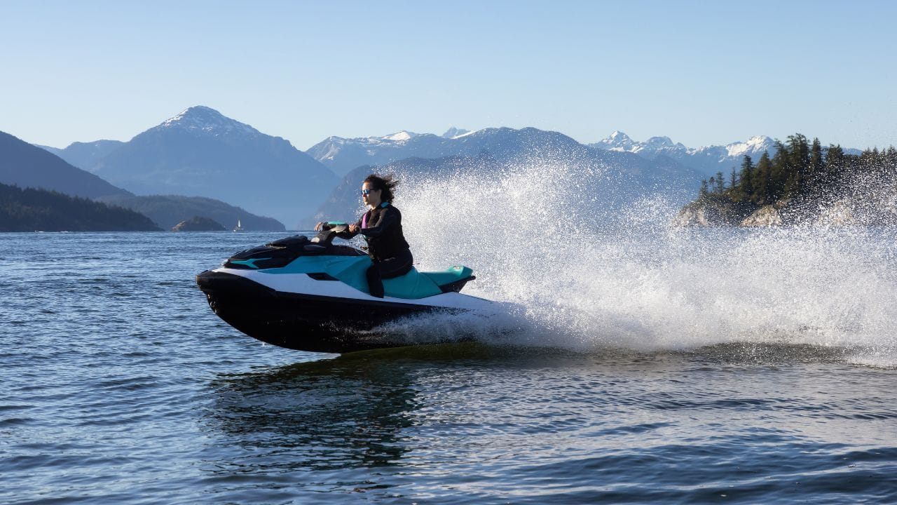 woman riding a jet ski SeaDoo in Alaska bay