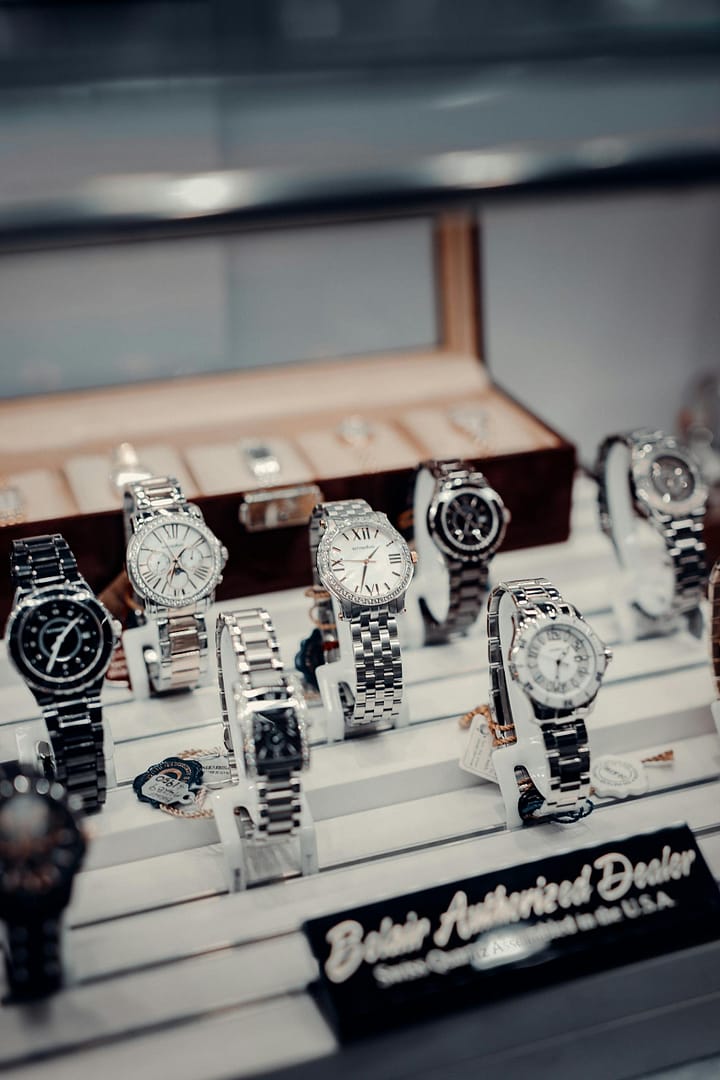 A stylish display of luxury wristwatches at a boutique authorized dealer.
