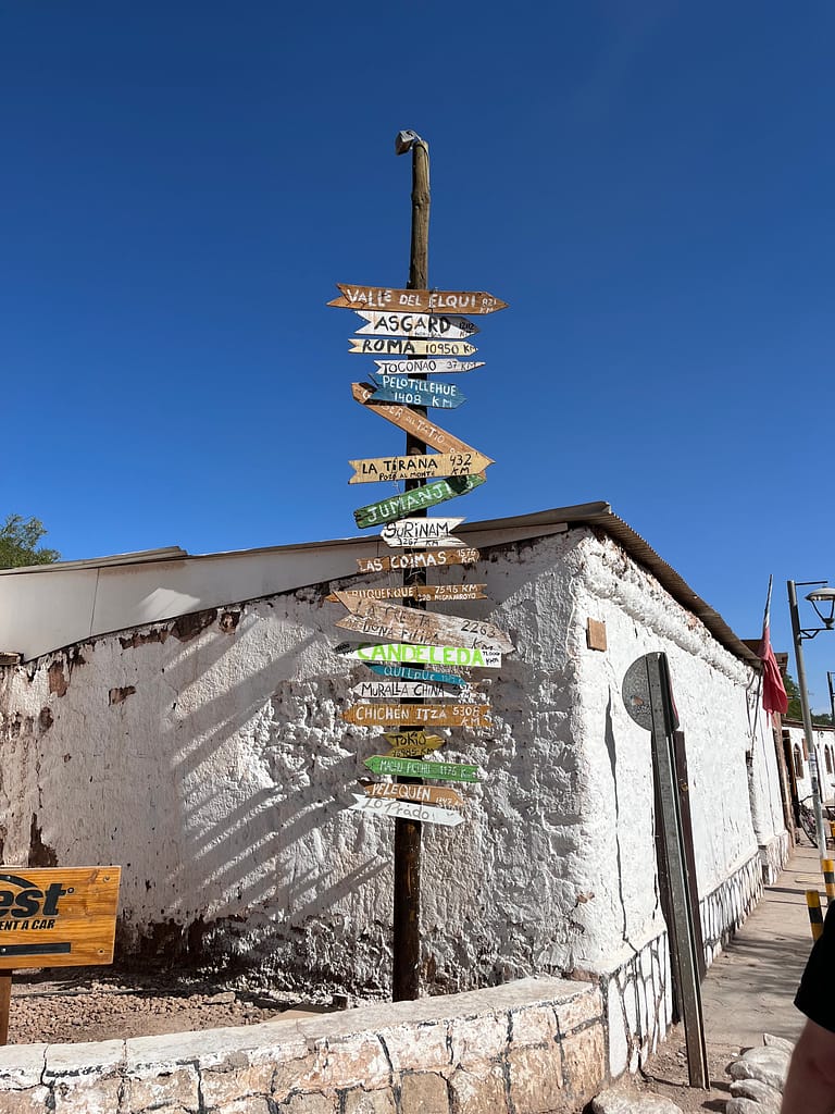 Signpost of destinations found in San Pedro de Atacama, Chile